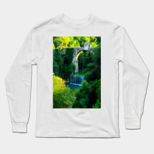 View of Cecco Bridge in Ascoli Piceno with waters of Castellano river flowing below and vegetation Long Sleeve T-Shirt